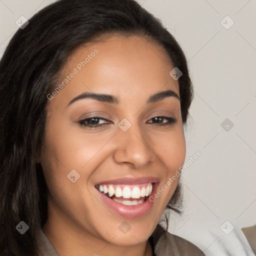 Joyful latino young-adult female with long  brown hair and brown eyes