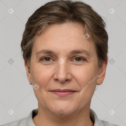 Joyful white adult female with short  brown hair and brown eyes