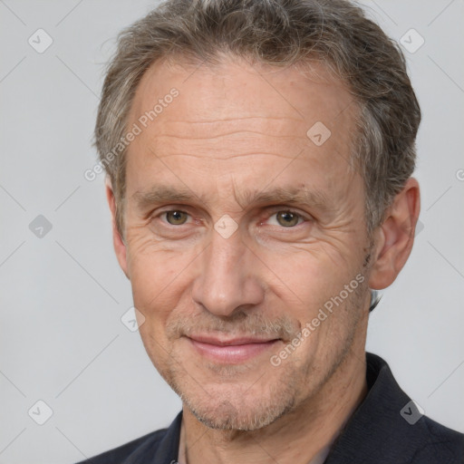 Joyful white middle-aged male with short  brown hair and brown eyes