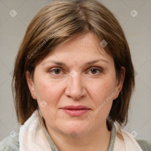Joyful white adult female with medium  brown hair and grey eyes