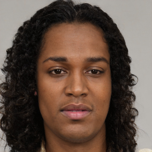 Neutral black young-adult female with long  brown hair and brown eyes