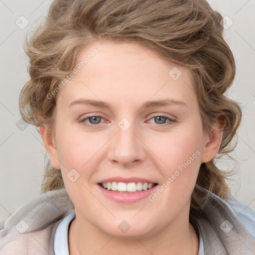 Joyful white young-adult female with medium  brown hair and blue eyes