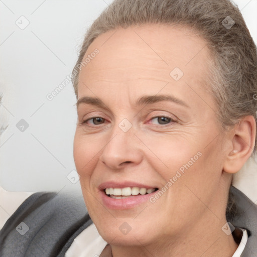 Joyful white adult female with short  brown hair and brown eyes