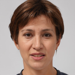 Joyful white adult female with short  brown hair and brown eyes