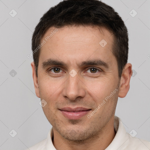 Joyful white adult male with short  brown hair and brown eyes