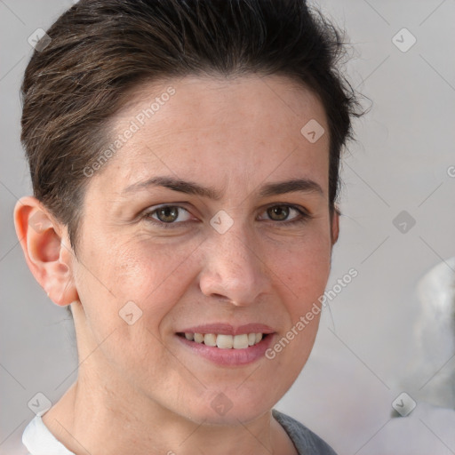 Joyful white adult female with short  brown hair and brown eyes