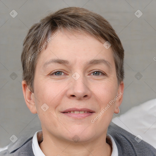 Joyful white adult male with short  brown hair and grey eyes