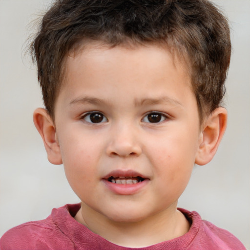 Joyful white child male with short  brown hair and brown eyes