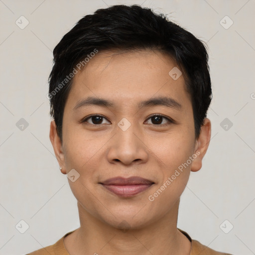 Joyful latino young-adult male with short  black hair and brown eyes