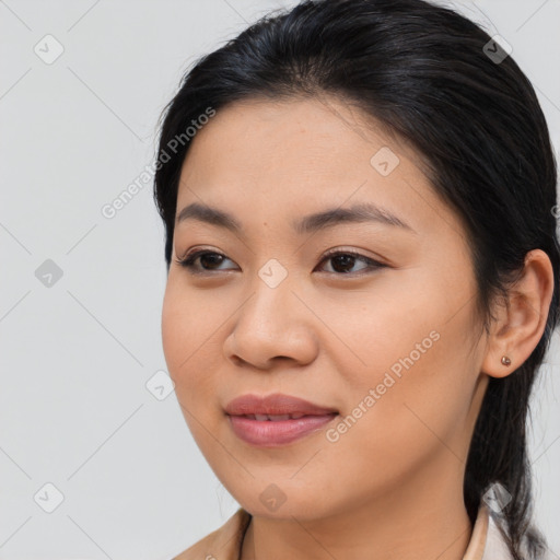 Joyful asian young-adult female with long  brown hair and brown eyes