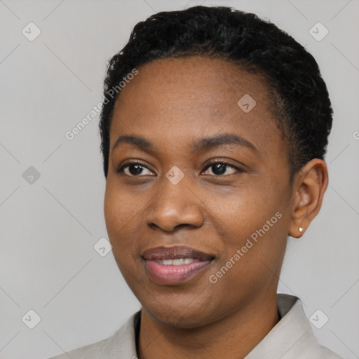 Joyful black young-adult female with short  black hair and brown eyes