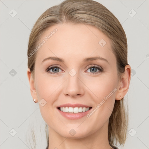 Joyful white young-adult female with medium  brown hair and blue eyes