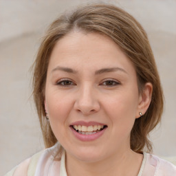 Joyful white young-adult female with medium  brown hair and blue eyes