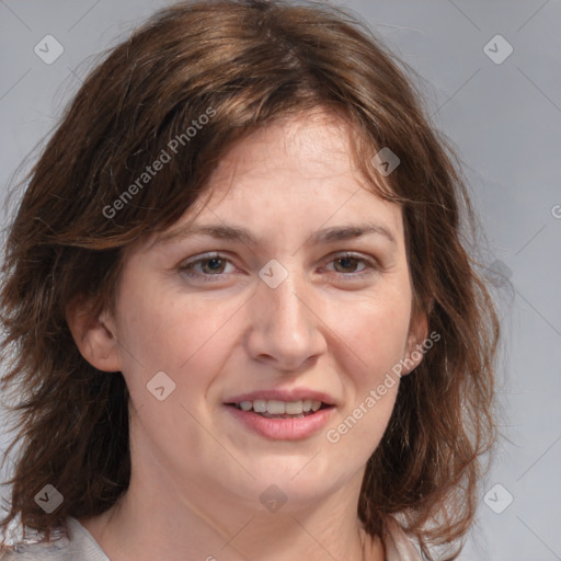 Joyful white young-adult female with medium  brown hair and blue eyes