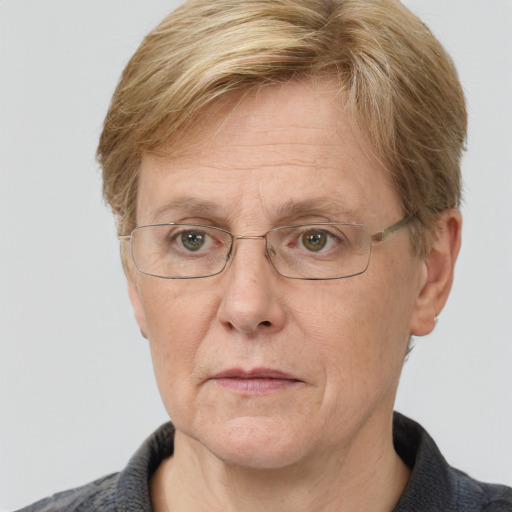 Joyful white middle-aged female with short  brown hair and grey eyes