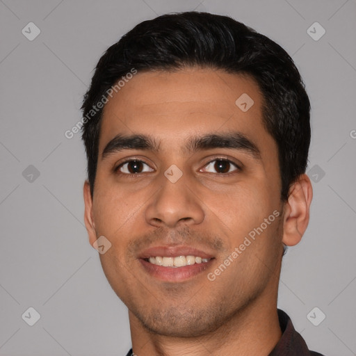 Joyful white young-adult male with short  black hair and brown eyes