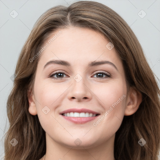 Joyful white young-adult female with long  brown hair and grey eyes