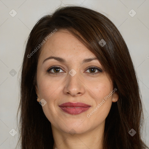 Joyful white adult female with long  brown hair and brown eyes