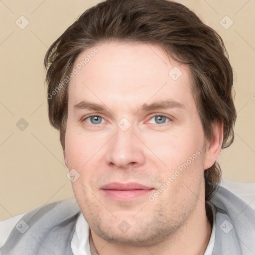 Joyful white adult male with short  brown hair and grey eyes