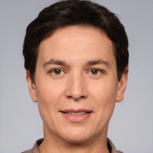 Joyful white adult male with short  brown hair and brown eyes