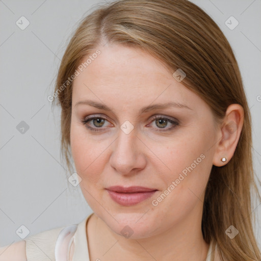 Joyful white young-adult female with medium  brown hair and blue eyes