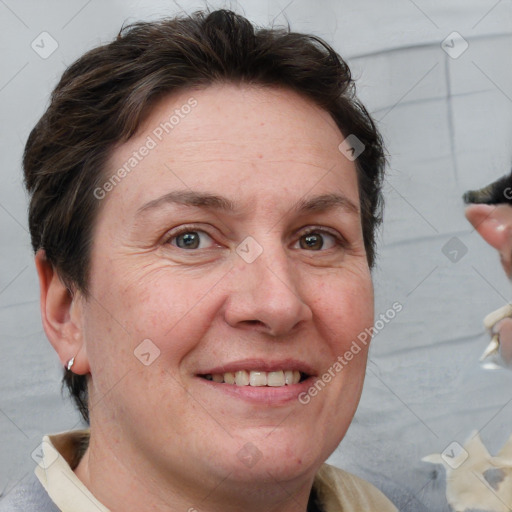 Joyful white adult female with short  brown hair and grey eyes