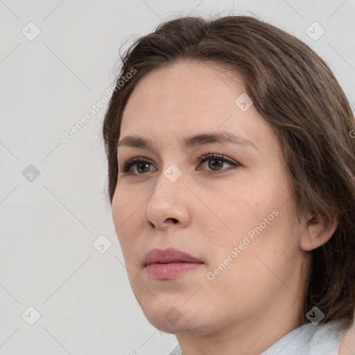 Neutral white young-adult female with medium  brown hair and brown eyes