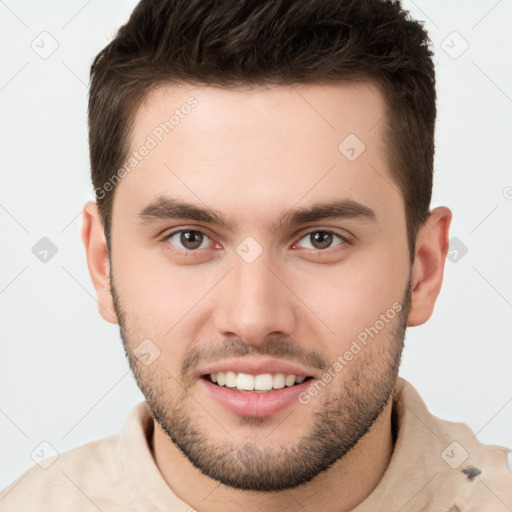 Joyful white young-adult male with short  brown hair and brown eyes