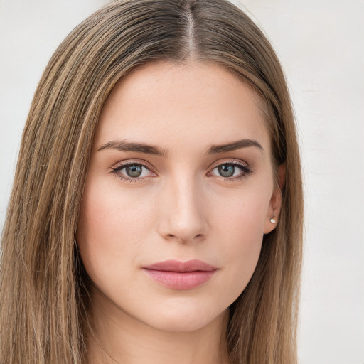 Neutral white young-adult female with long  brown hair and green eyes