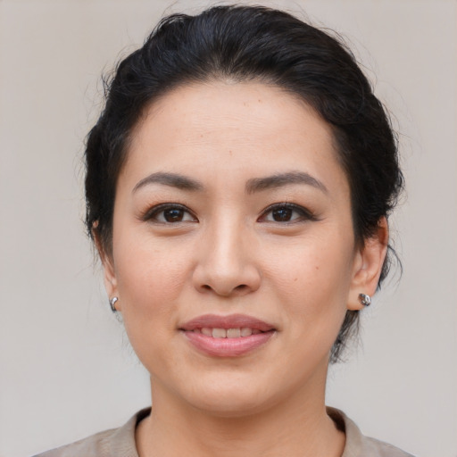 Joyful asian young-adult female with medium  brown hair and brown eyes