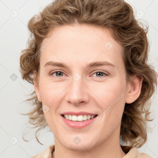 Joyful white young-adult female with medium  brown hair and blue eyes