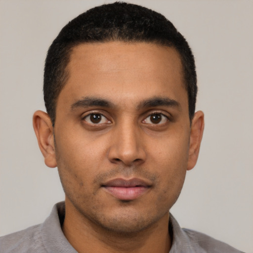 Neutral latino young-adult male with short  black hair and brown eyes