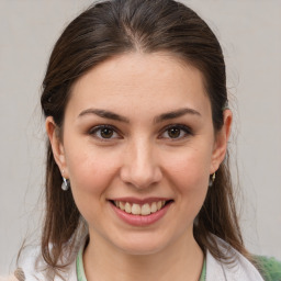 Joyful white young-adult female with medium  brown hair and brown eyes