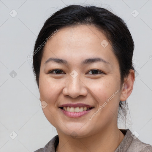 Joyful white young-adult female with short  brown hair and brown eyes