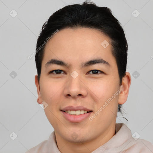 Joyful asian young-adult male with short  brown hair and brown eyes