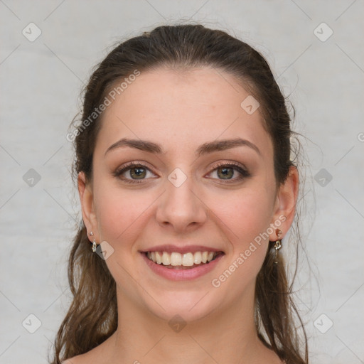 Joyful white young-adult female with medium  brown hair and grey eyes