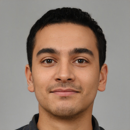 Neutral latino young-adult male with short  black hair and brown eyes