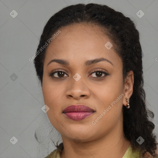 Joyful black young-adult female with long  brown hair and brown eyes