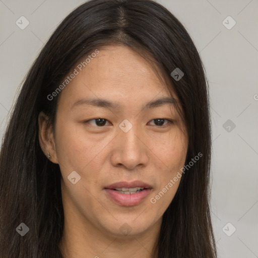 Joyful asian young-adult female with long  brown hair and brown eyes