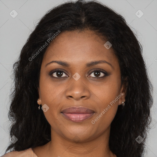 Joyful black young-adult female with long  brown hair and brown eyes