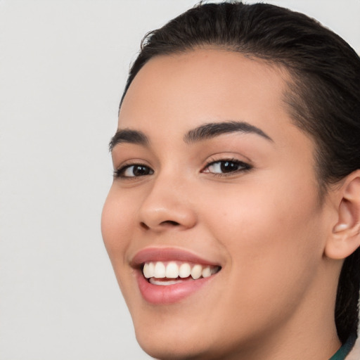 Joyful white young-adult female with medium  brown hair and brown eyes