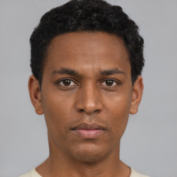 Neutral black young-adult male with short  brown hair and brown eyes