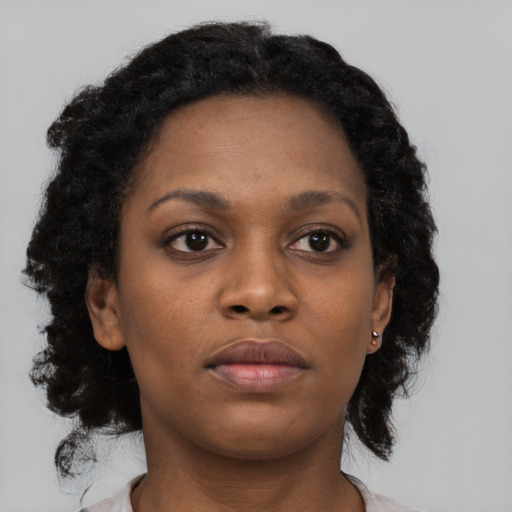 Neutral black young-adult female with medium  black hair and brown eyes