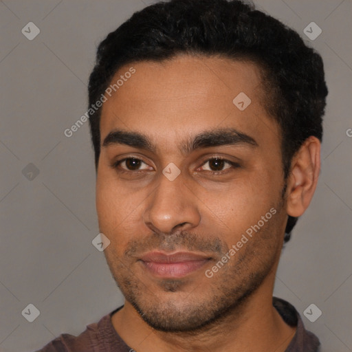 Joyful black young-adult male with short  black hair and brown eyes