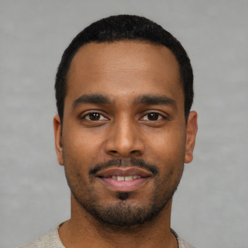 Neutral black young-adult male with short  black hair and brown eyes