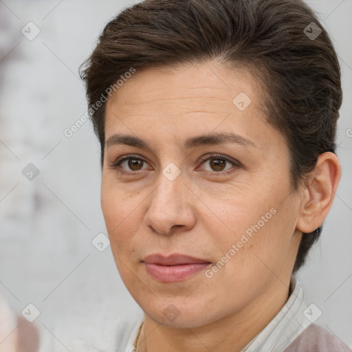 Joyful white adult female with short  brown hair and brown eyes