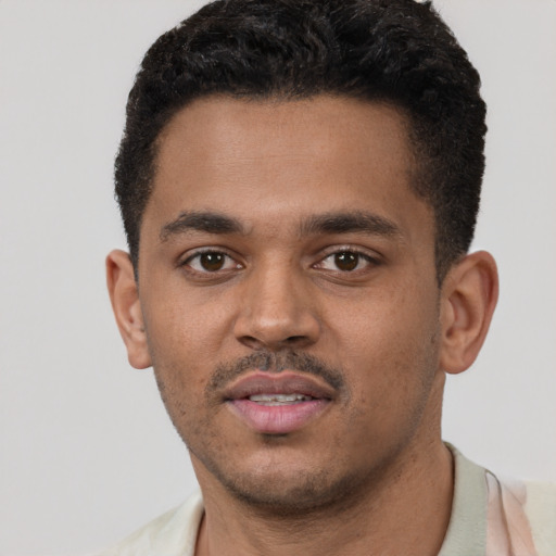 Neutral black young-adult male with short  black hair and brown eyes