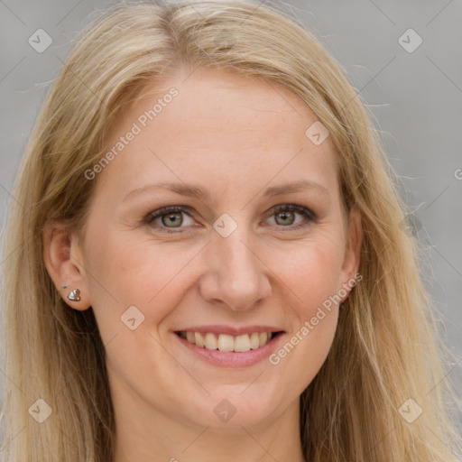 Joyful white adult female with long  brown hair and grey eyes