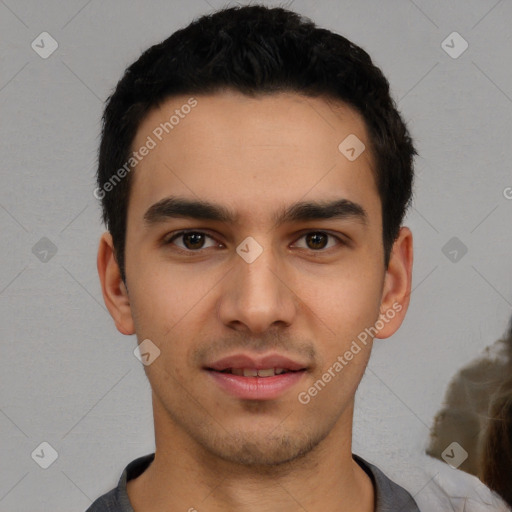 Joyful white young-adult male with short  black hair and brown eyes