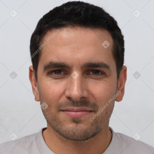 Joyful white young-adult male with short  black hair and brown eyes